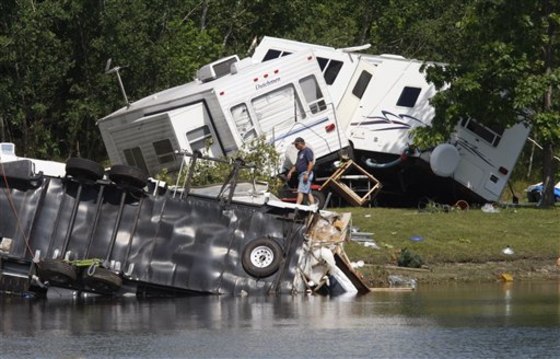 Overturned trailers are visible at the Fort Trodd Family Campground in Clyde Township, Mich., on Monday.